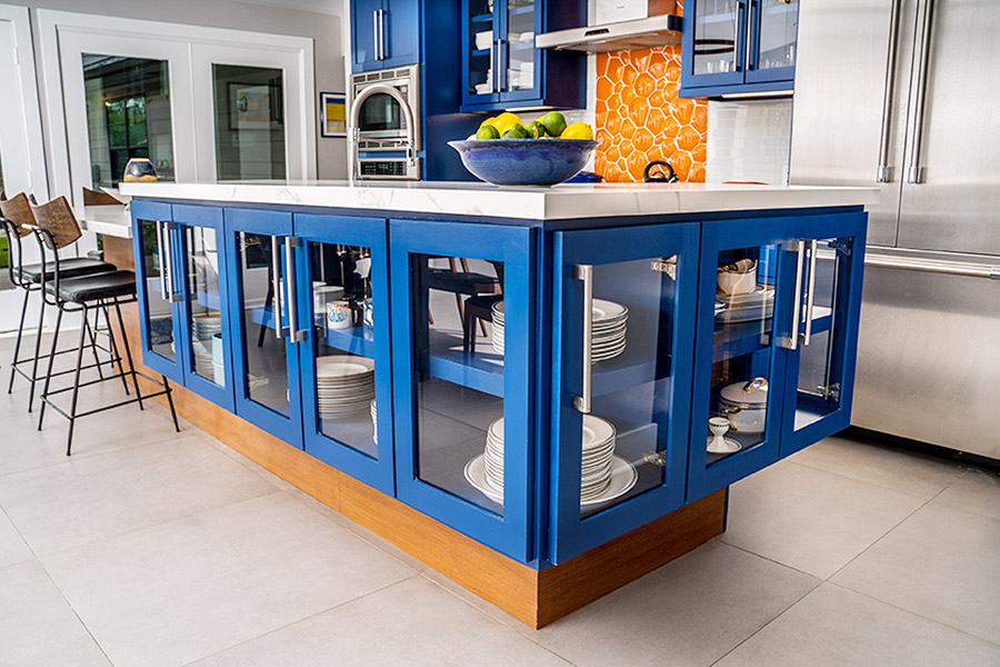 kitchen island with built in cabinets painted in blue around the frames.