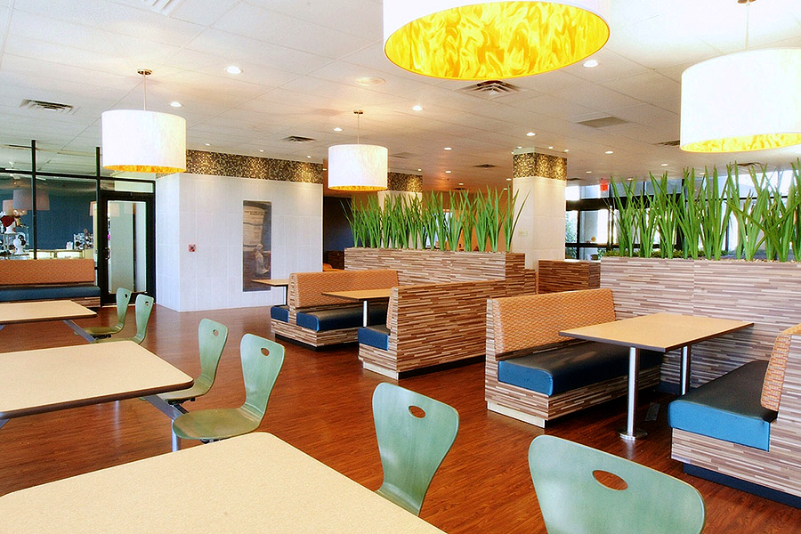Turquoise dining chairs in the cafeteria of a rehab center