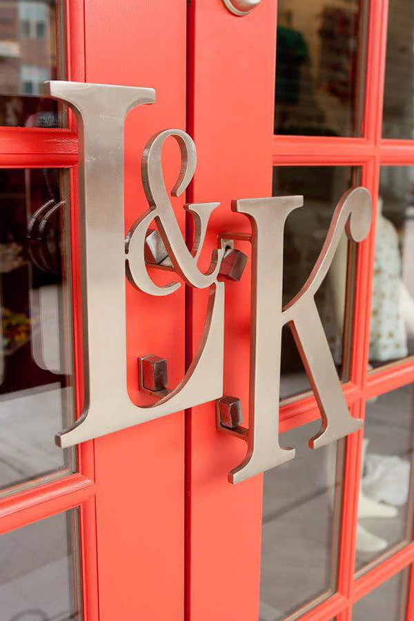 Signage designed for store front door as initials of the business L & K for Liz & Kirby, by Shundra Harris
