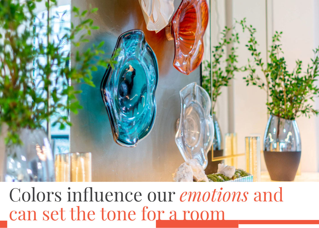 Glass wall art with vibrant colors in a modern room, showing how interior design choices influence mood and atmosphere.